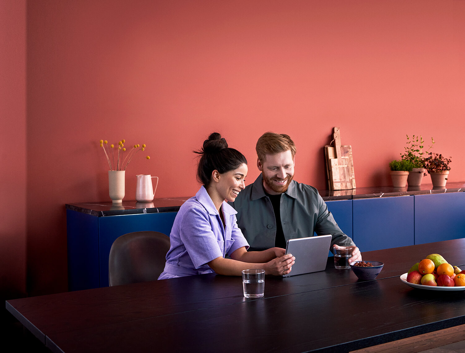 Two people having working on a ipad together
