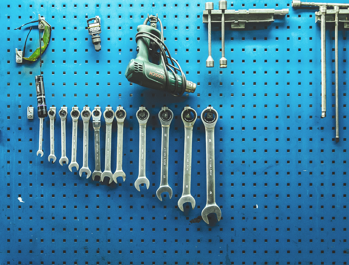 Image of tools hanging on a wall